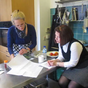 Emily discussing recipes with food stylist Sarah.